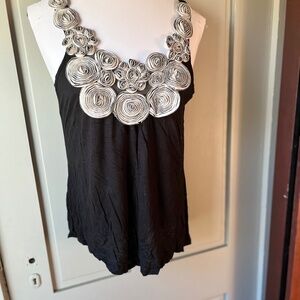 Unique tank with light grey flower design across top